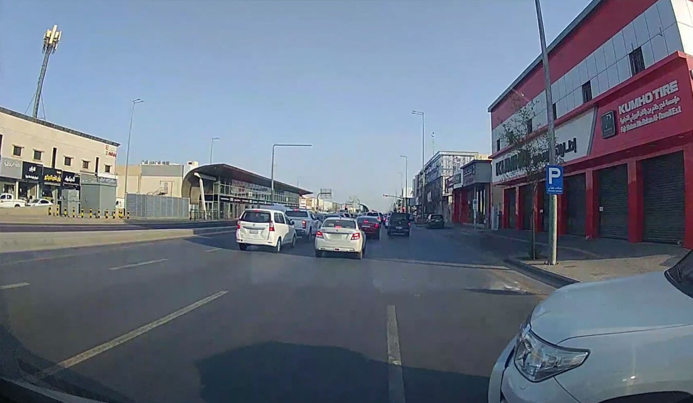 Dash camera view from close behind a van in motorway traffic